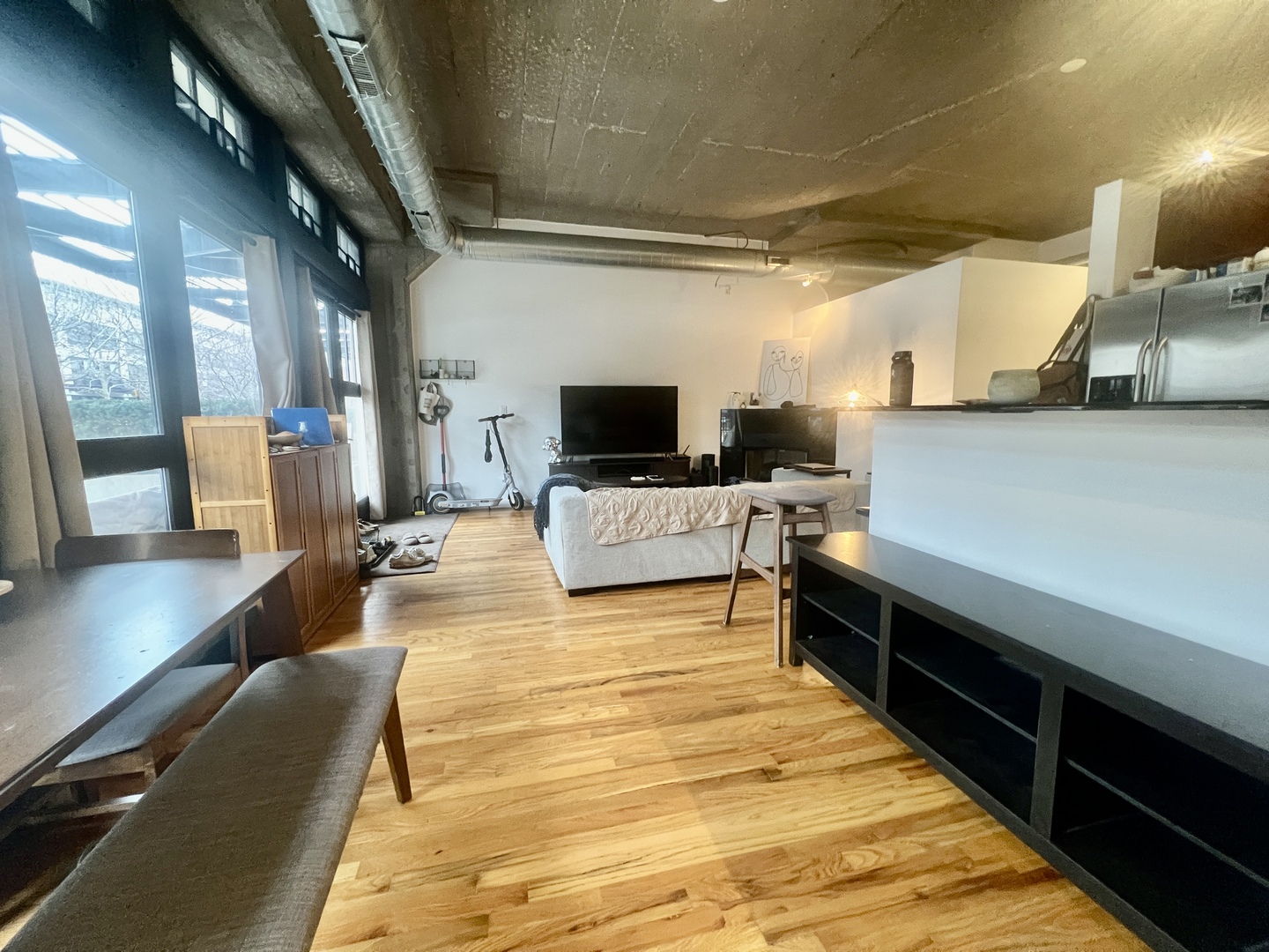1151 West 15th Street, Unit 137 Chicago, IL 60608 - Photo 4 of 27 a lobby with furniture and flat screen tv
