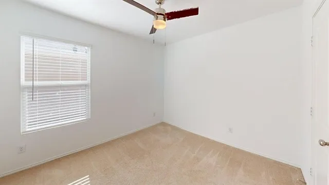 a view of a room that has a window in it