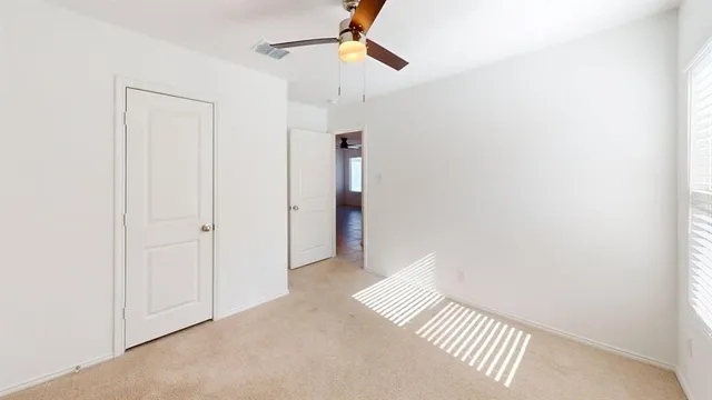 a view of a hallway with closet