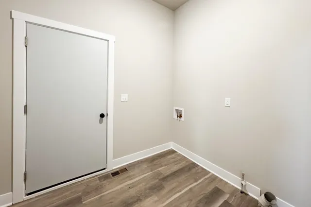 a view of a small space with wooden floor
