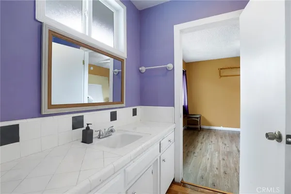 a bathroom with a sink and a mirror