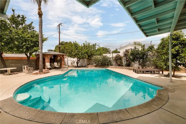 a view of a swimming pool with a patio
