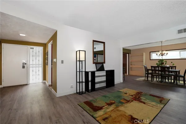 a living room with furniture rug and window