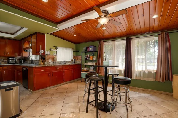 a room with chairs a dining table and chairs