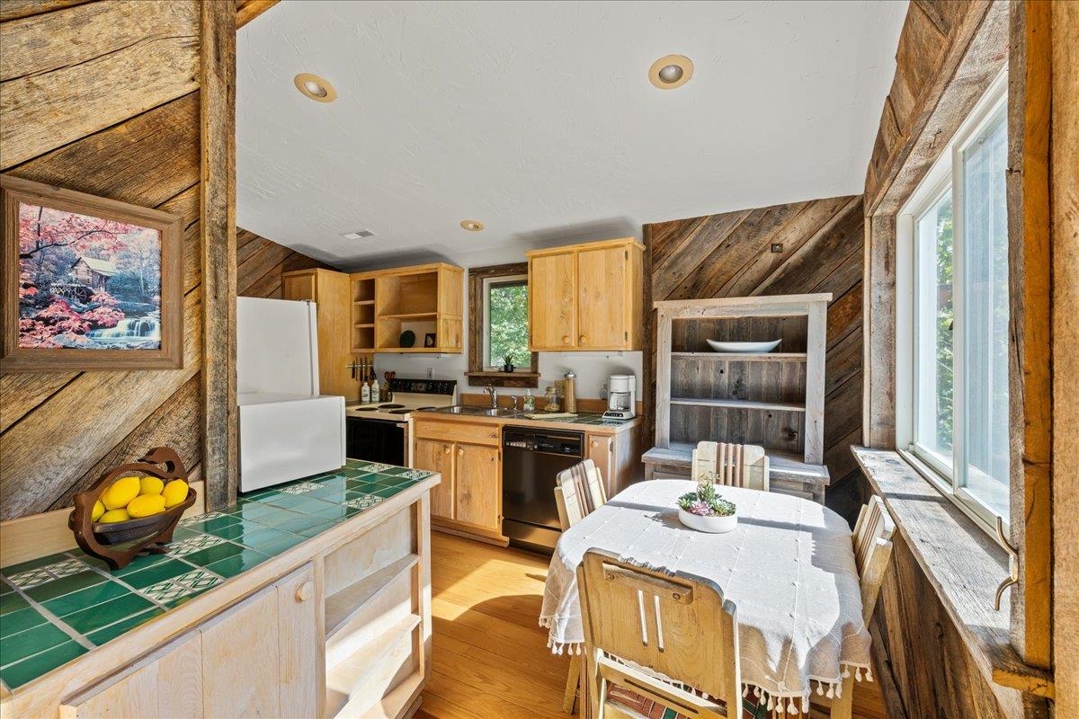 6602 Middlebrook Road Raphine, VA 24472 - Photo 27 of 68 a kitchen with stainless steel appliances granite countertop a stove a sink and a microwave