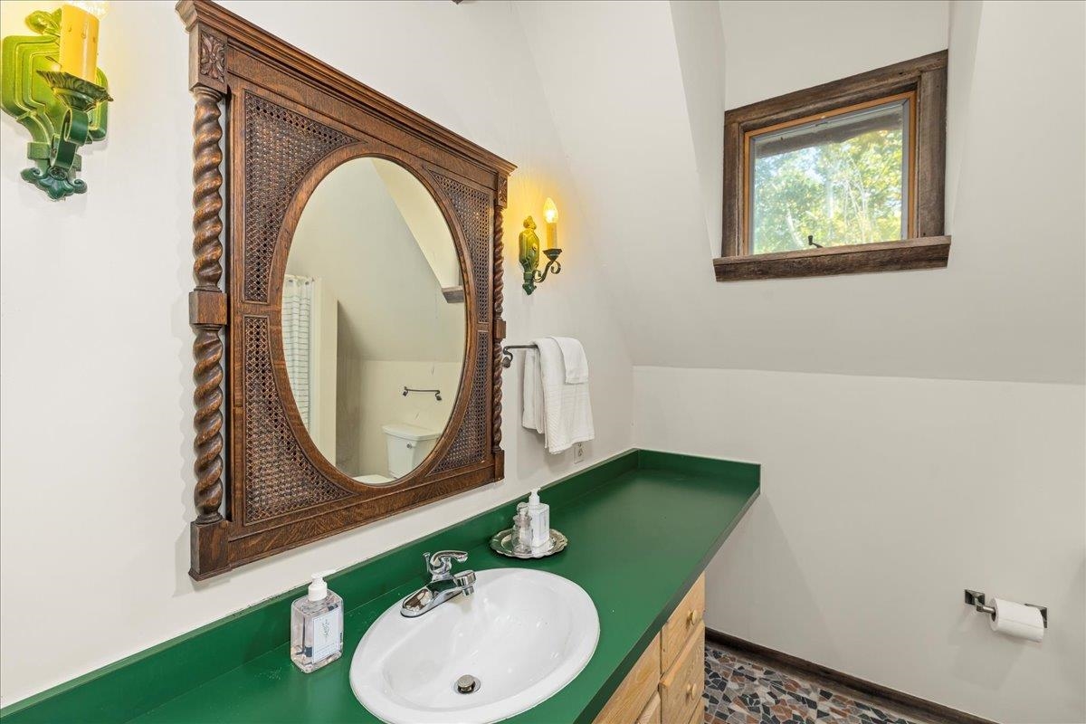 6602 Middlebrook Road Raphine, VA 24472 - Photo 42 of 68 a bathroom with a sink mirror and vanity