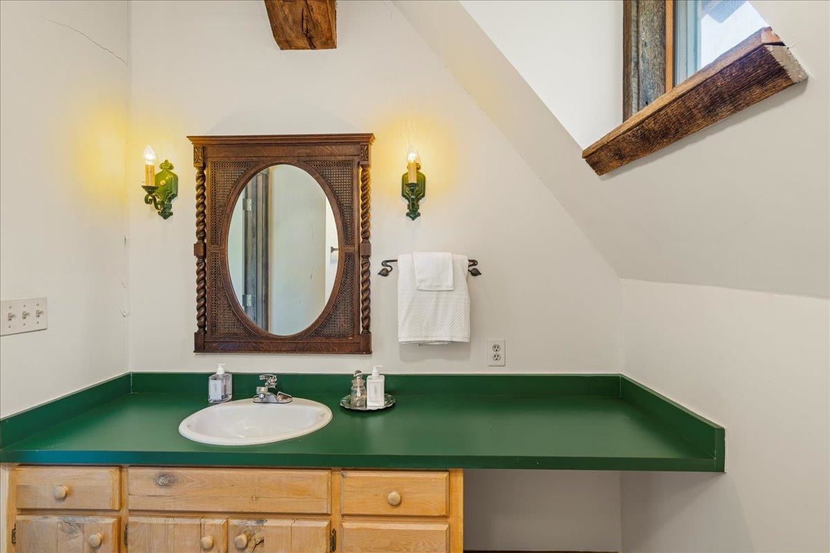 6602 Middlebrook Road Raphine, VA 24472 - Photo 43 of 68 a bathroom with a sink and a mirror