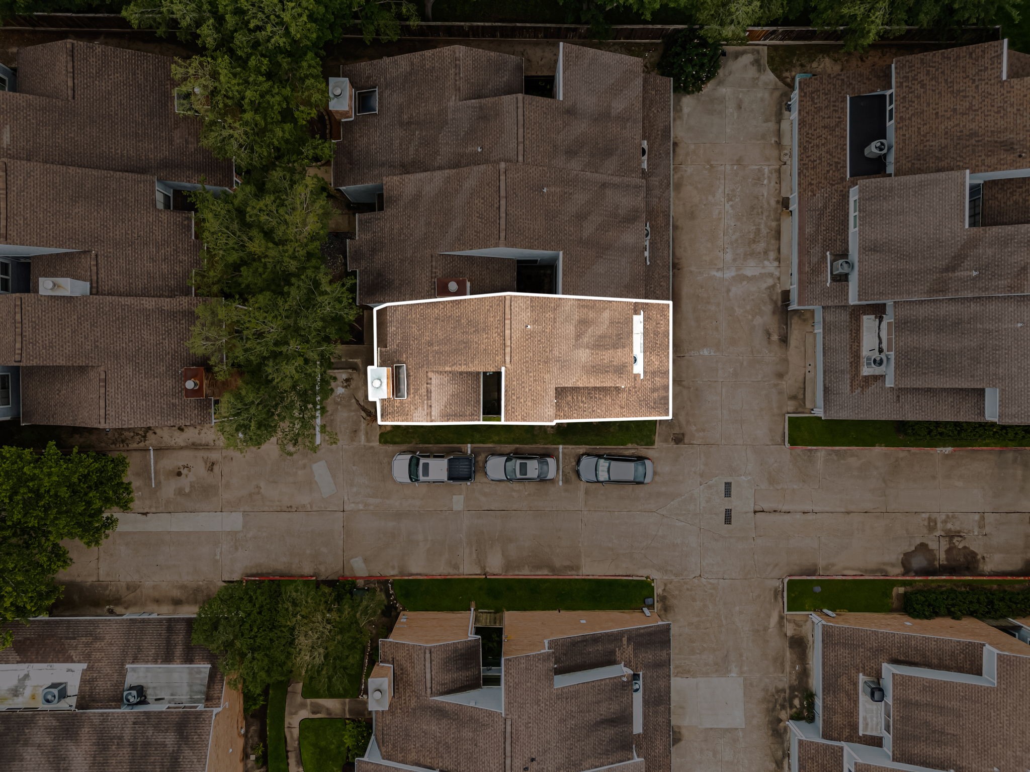 3200 South Gessner Road, Unit 228 Houston, TX 77063 - Photo 2 of 18 This aerial view highlights unit #228, perfectly situated within the well-maintained Townhomes at Westchase community, featuring mature trees, ample guest parking just steps from the front door, and easy access to major Houston thoroughfares. A fantastic location in the heart of it all!