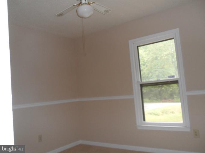 137 Choptank Road Stafford, VA 22556 - Photo 8 of 9 a view of a small space with wooden floor and windows