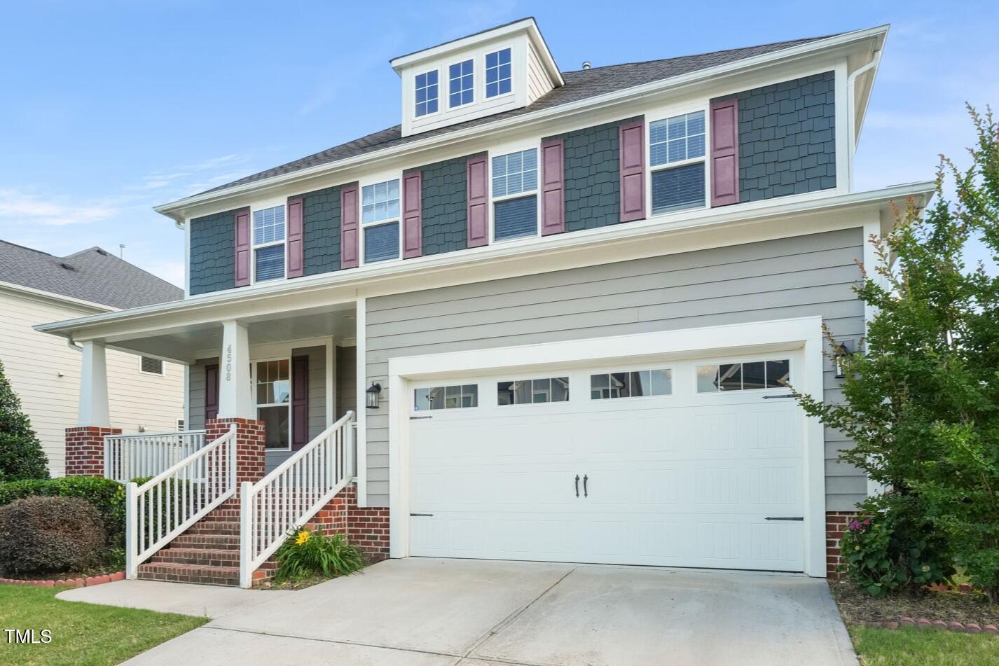 4508 Brintons Cottage Street Raleigh, NC 27616 - Photo 35 of 46 a front view of a building with a lots of windows