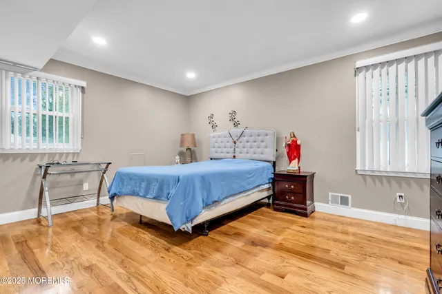 a bedroom with a bed and a table in it