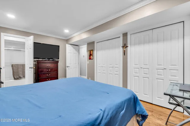 a bed room with a bed and a television in it