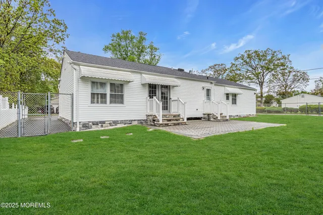 a view of a backyard with a garden and plants