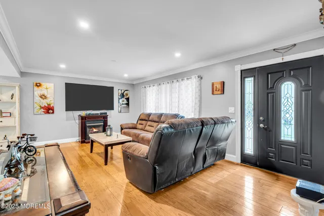 a living room with furniture window and a flat screen tv