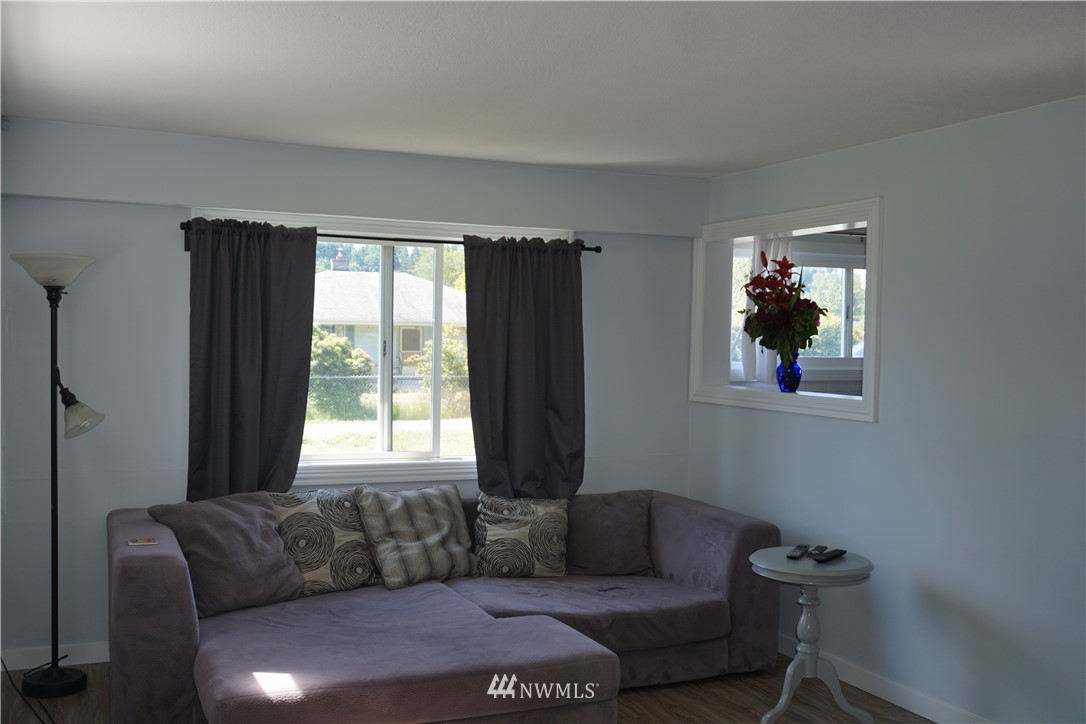 1507 South Machias Road Snohomish, WA 98290 - Photo 14 of 22 a living room with furniture and a window