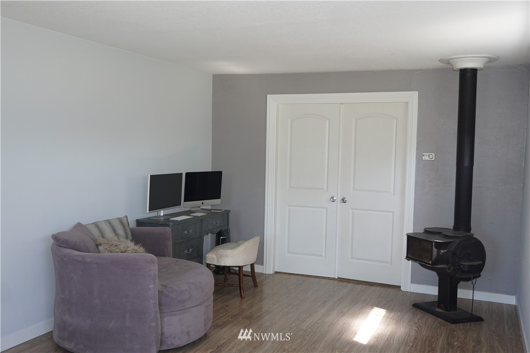 1507 South Machias Road Snohomish, WA 98290 - Photo 15 of 22 a living room with furniture and a flat screen tv