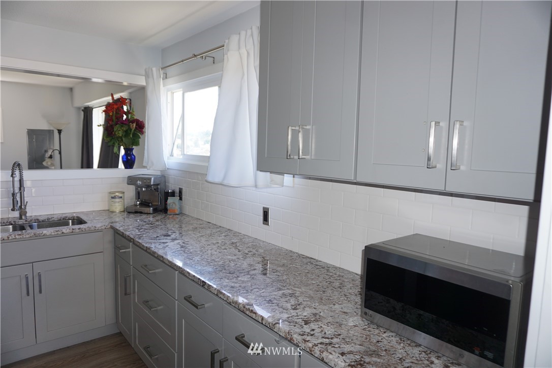 1507 South Machias Road Snohomish, WA 98290 - Photo 21 of 22 a kitchen with sink cabinets and window