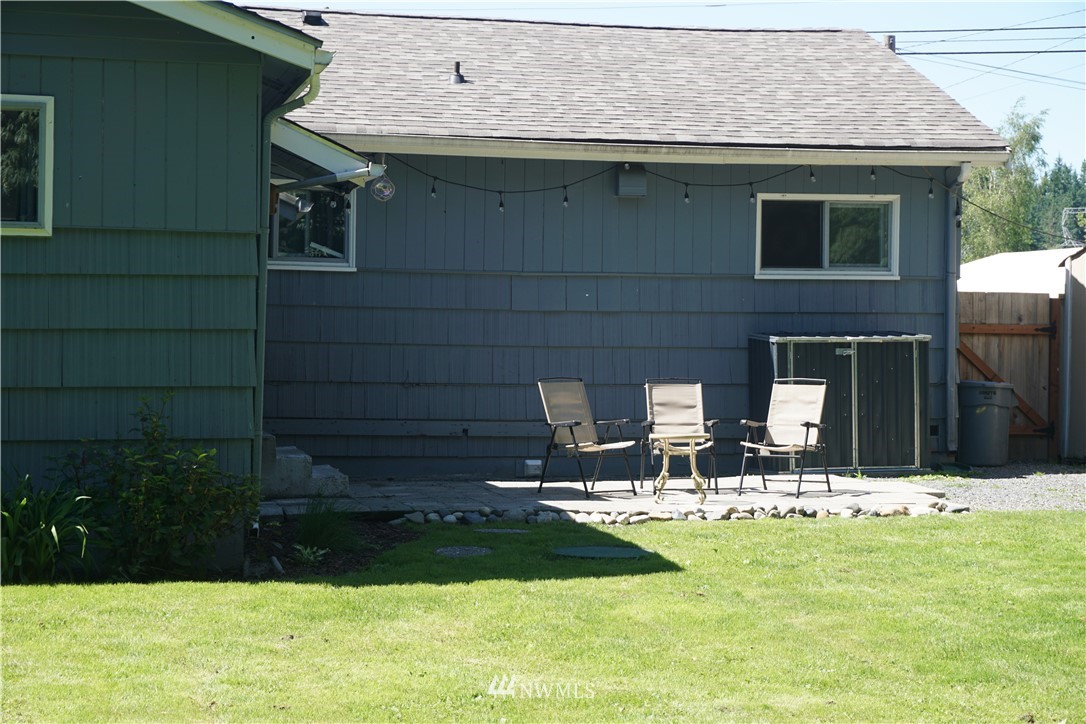 1507 South Machias Road Snohomish, WA 98290 - Photo 7 of 22 a backyard of a house with yard and outdoor seating
