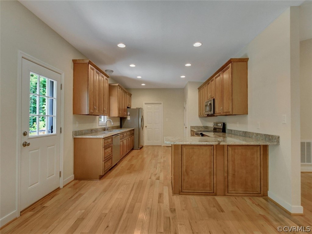 4720 Powhatan Lakes Road Powhatan, VA 23139 - Photo 13 of 35 Kitchen with granite counter-tops, breakfast bar,