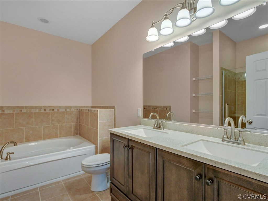 4720 Powhatan Lakes Road Powhatan, VA 23139 - Photo 22 of 35 Spa-like en-suite bathroom with double vanity, soa