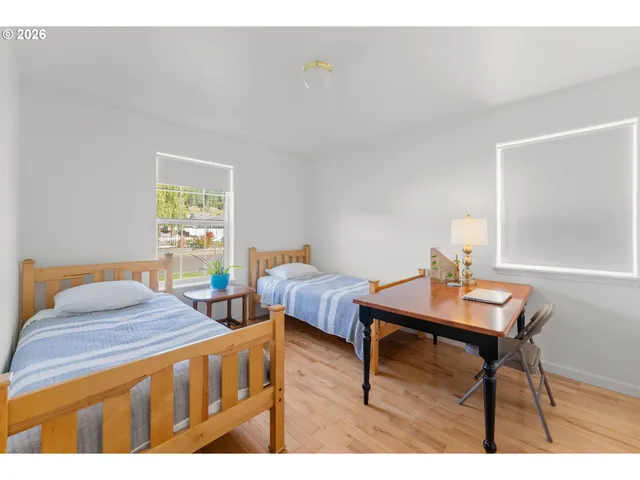 a bedroom with furniture and a window