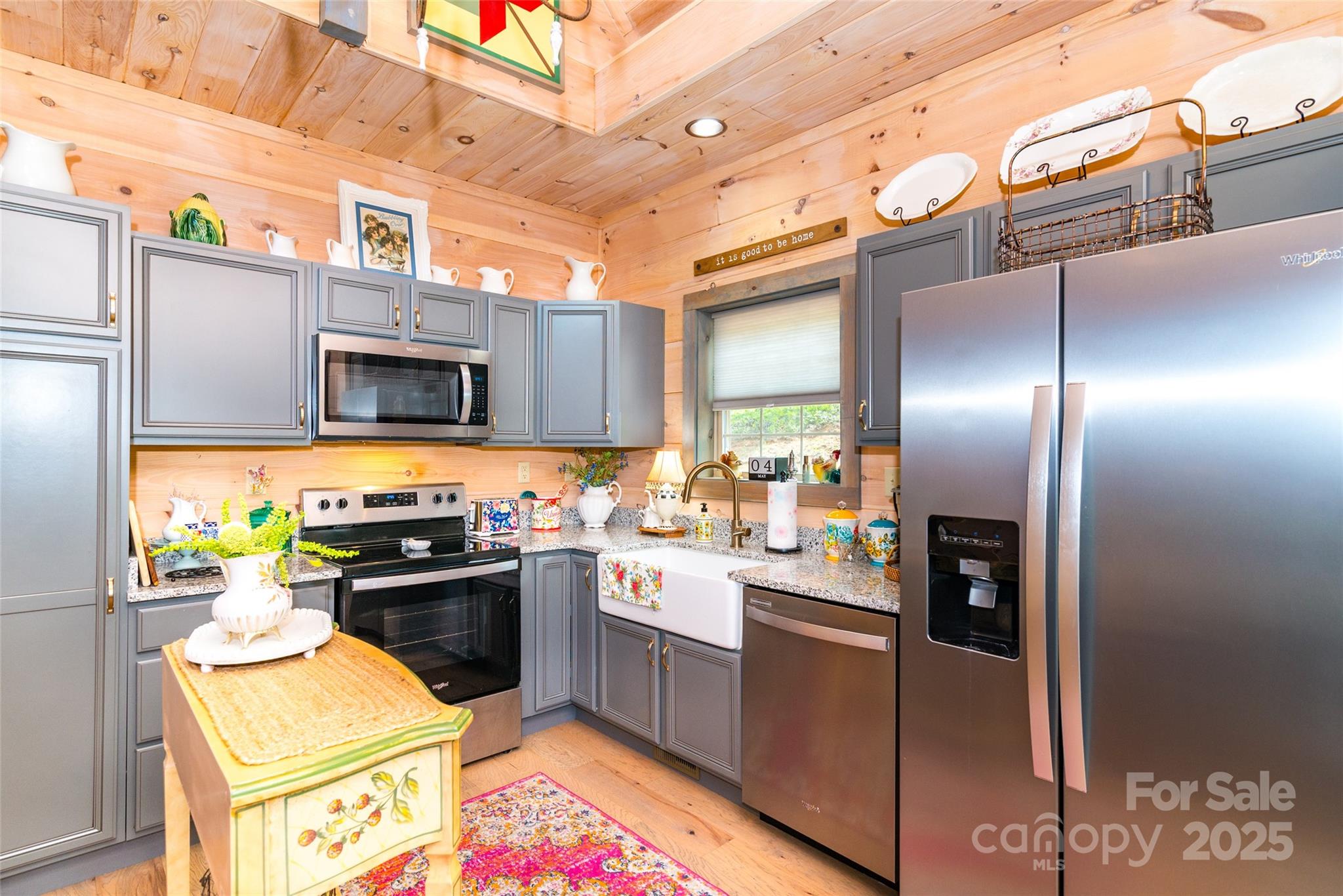 720 Cedar Creek Farm Road Tuckasegee, NC 28783 - Photo 12 of 19 a kitchen with stainless steel appliances a stove a sink and a refrigerator