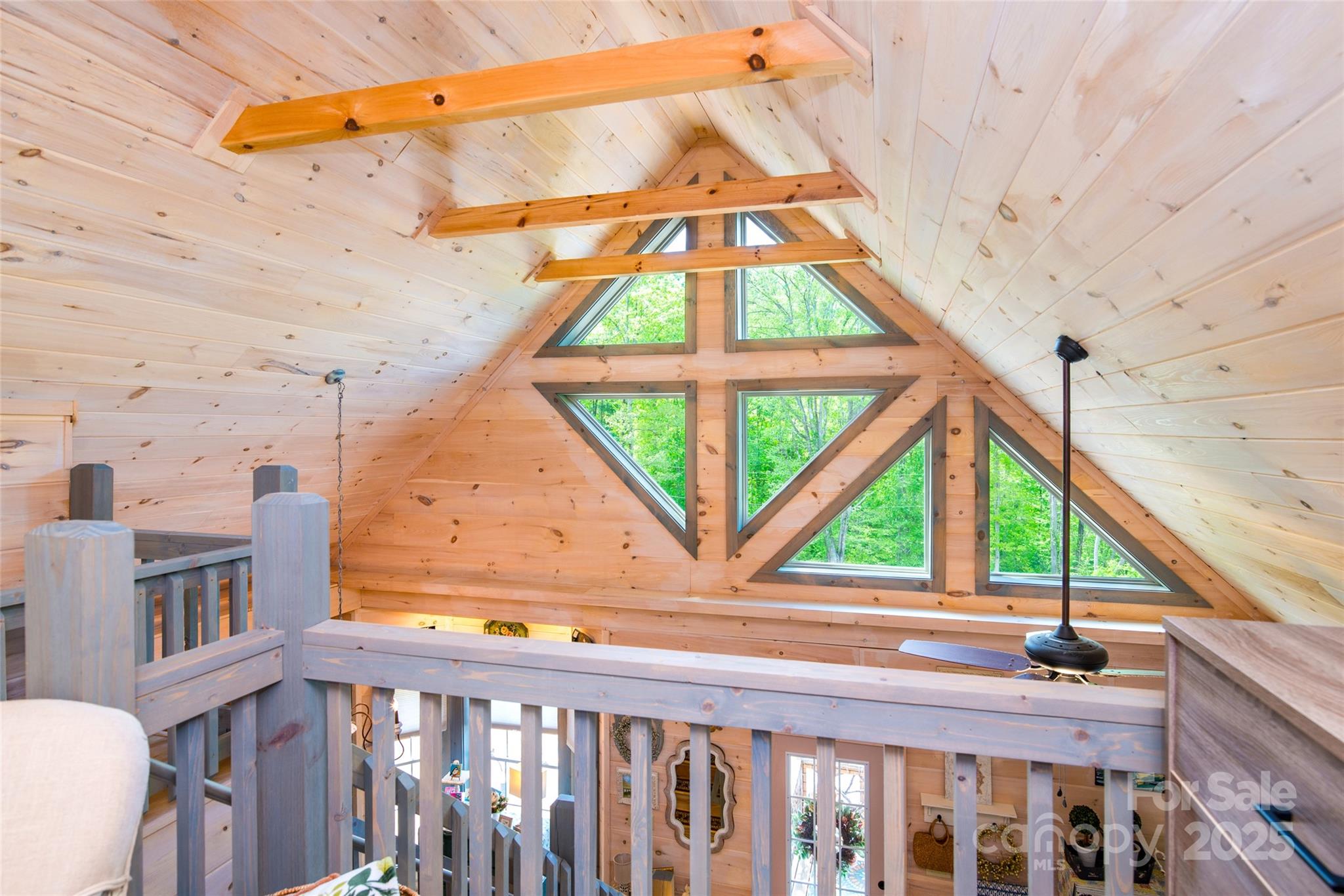 720 Cedar Creek Farm Road Tuckasegee, NC 28783 - Photo 15 of 19 a view of a blue and white umbrella in a balcony