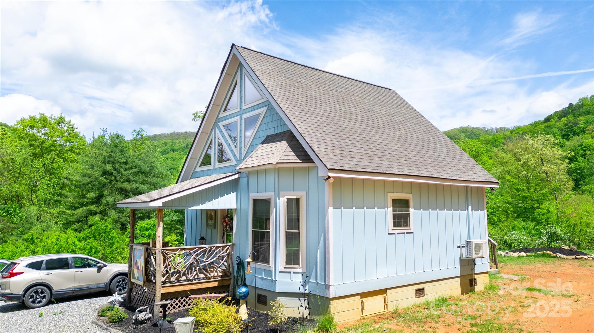 720 Cedar Creek Farm Road Tuckasegee, NC 28783 - Photo 3 of 19 a view of a house with patio