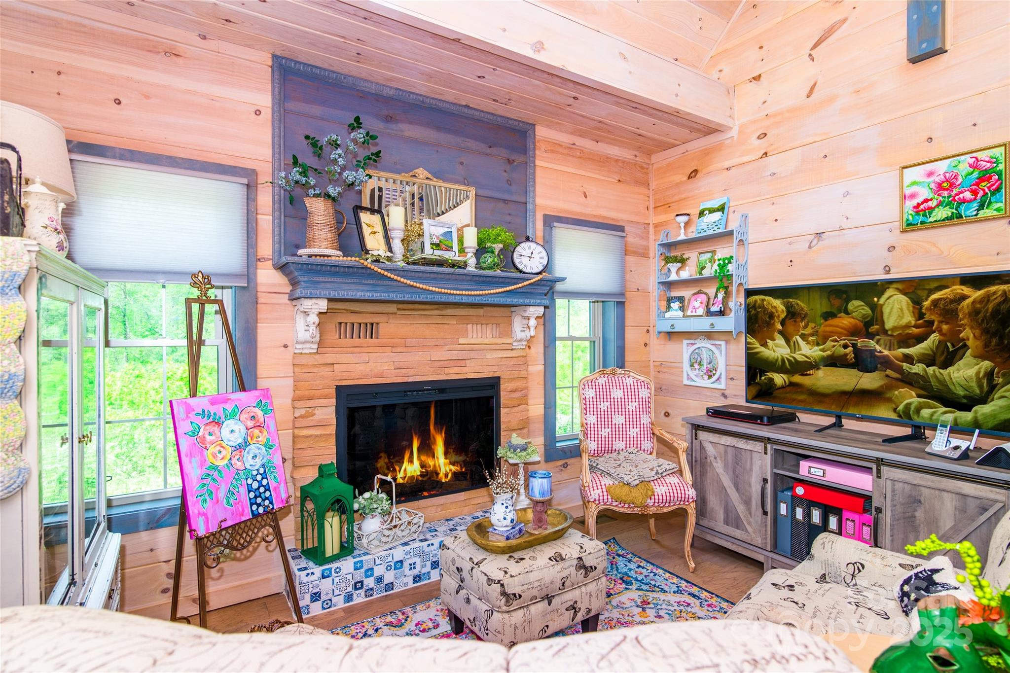 720 Cedar Creek Farm Road Tuckasegee, NC 28783 - Photo 10 of 19 a living room with furniture and a fireplace