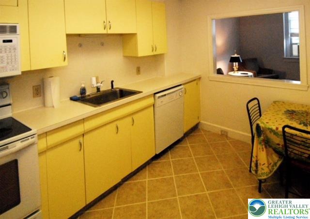 606 West Broad Street, Unit F Bethlehem, PA 18018 - Photo 6 of 23 The kitchen looks into the living room and receives the cheery daylight...