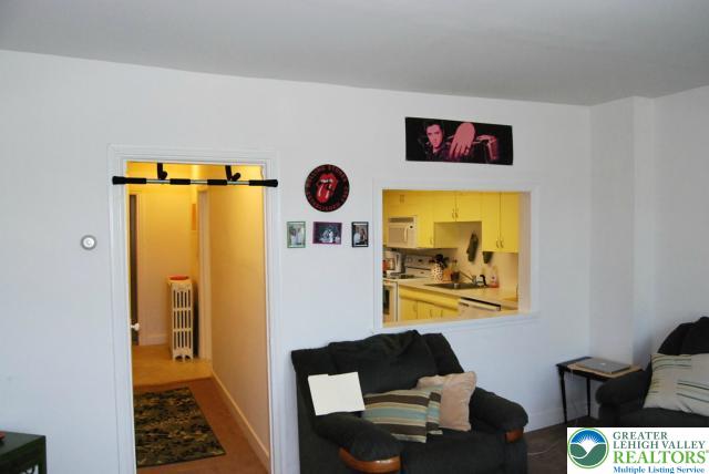 606 West Broad Street, Unit F Bethlehem, PA 18018 - Photo 7 of 23 The large, sun-lit living room adjoins the kitchen...