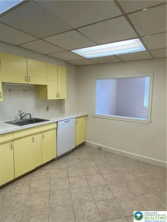 a view of an empty room and a window
