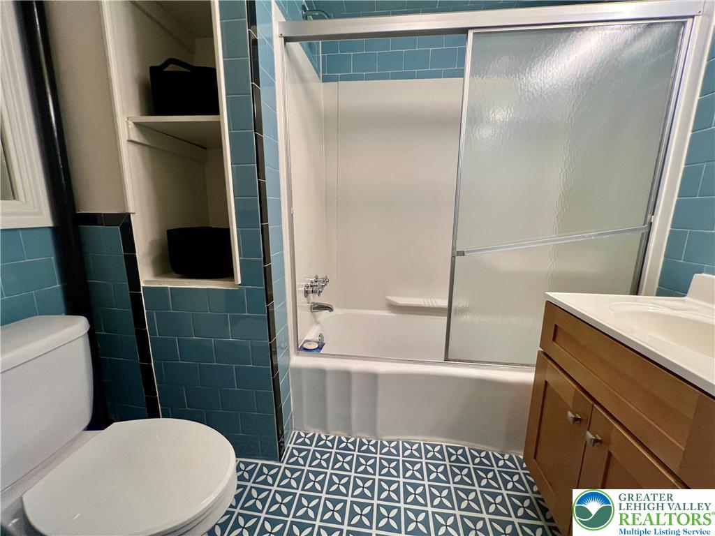 606 West Broad Street, Unit F Bethlehem, PA 18018 - Photo 9 of 12 a bathroom with a toilet and a shower