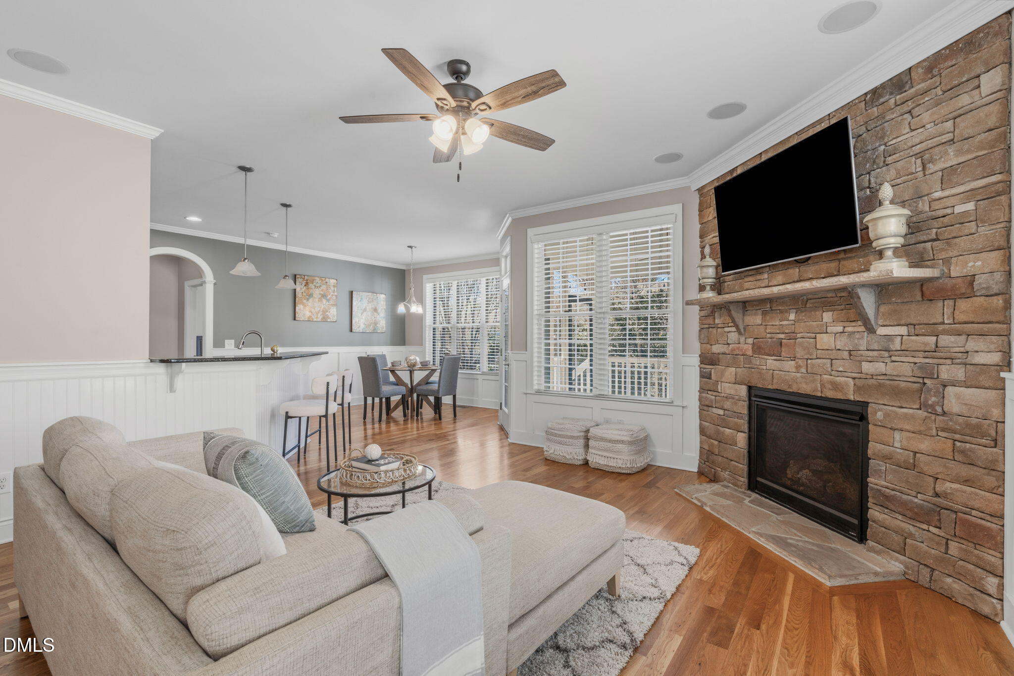 7320 Bedford Ridge Drive Apex, NC 27539 - Photo 10 of 64 a living room with furniture fireplace and a flat screen tv