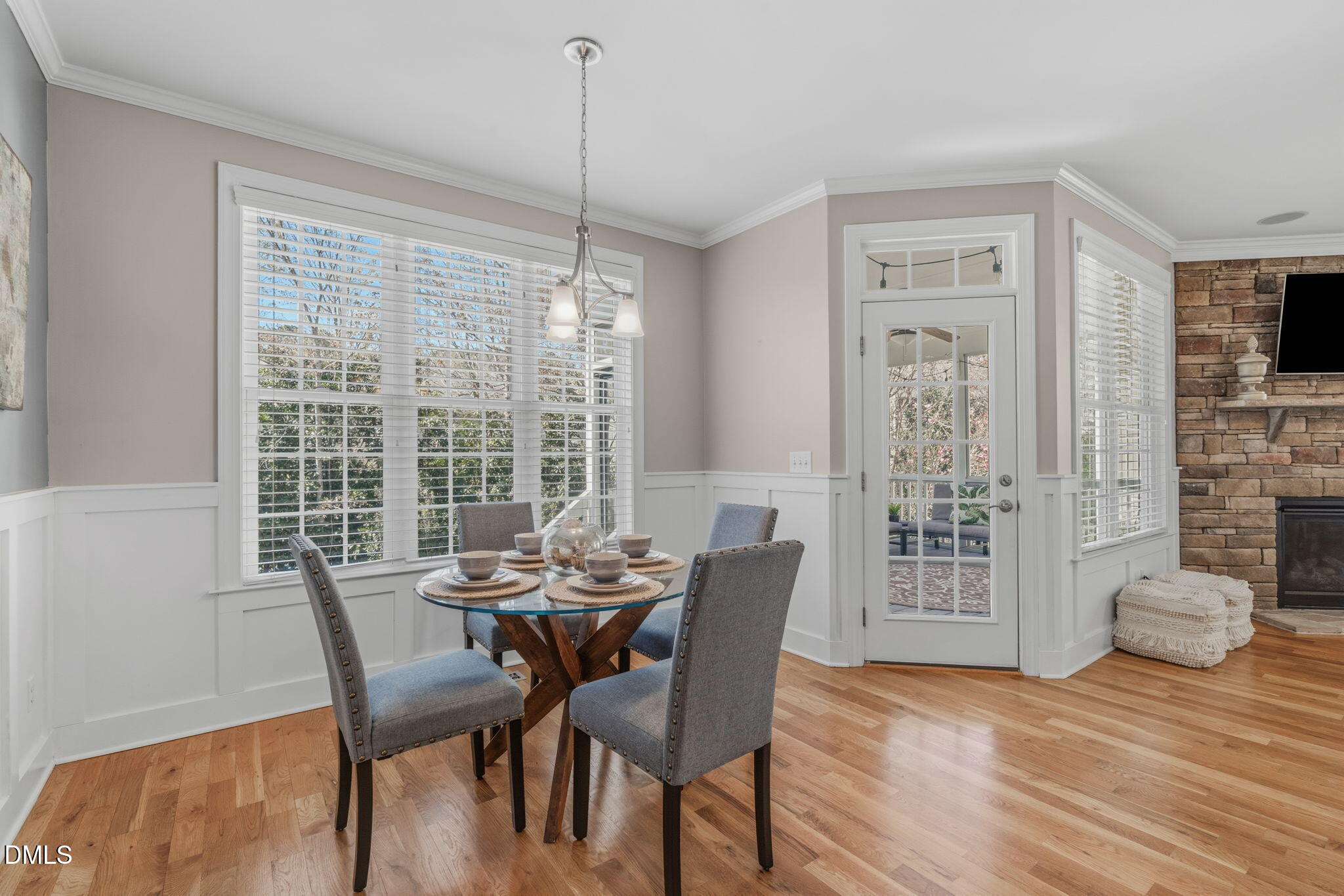 7320 Bedford Ridge Drive Apex, NC 27539 - Photo 18 of 64 a view of a dining room with furniture window and wooden floor