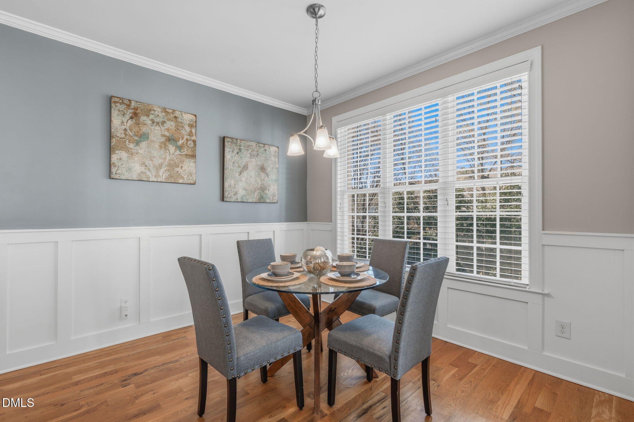 7320 Bedford Ridge Drive Apex, NC 27539 - Photo 19 of 64 a view of a dining room with furniture window and wooden floor