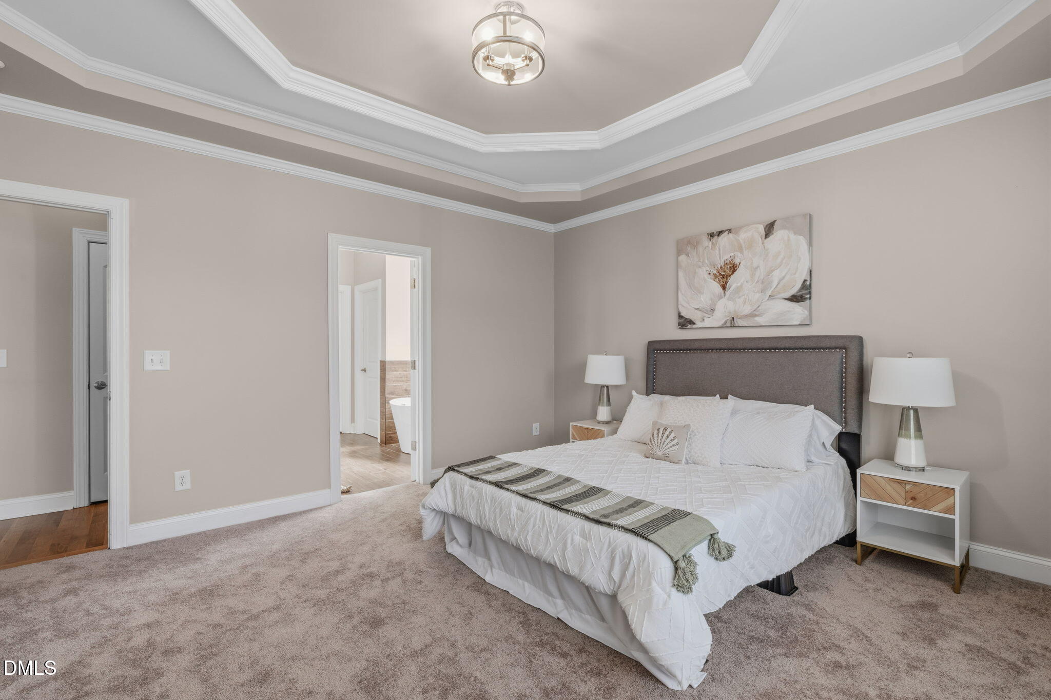 7320 Bedford Ridge Drive Apex, NC 27539 - Photo 27 of 64 a bedroom with a bed and a painting on the wall
