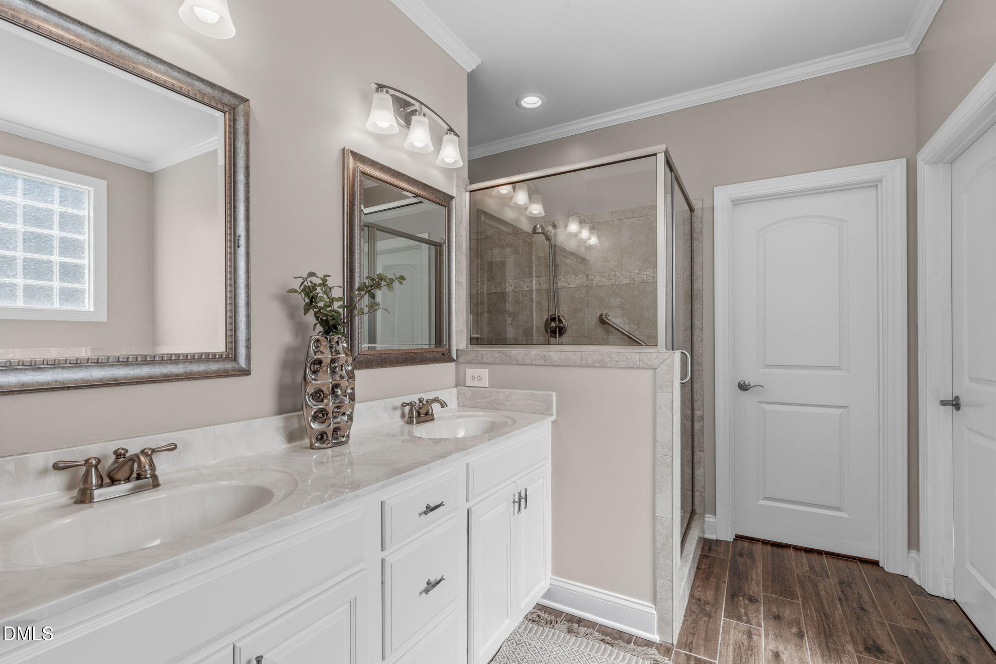 7320 Bedford Ridge Drive Apex, NC 27539 - Photo 31 of 64 a bathroom with double vanity and a mirror