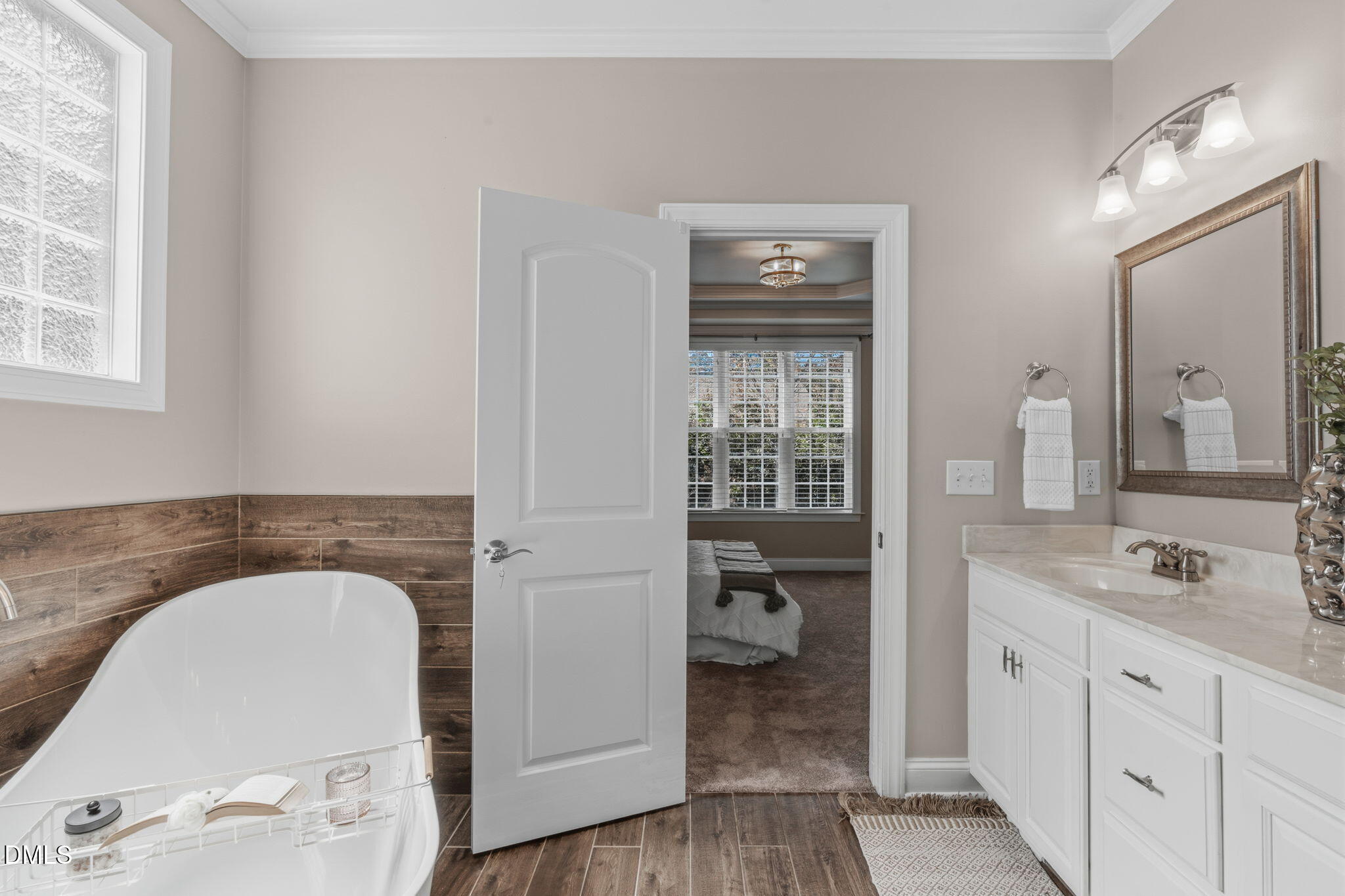 7320 Bedford Ridge Drive Apex, NC 27539 - Photo 32 of 64 a spacious bathroom with a granite countertop sink and a mirror