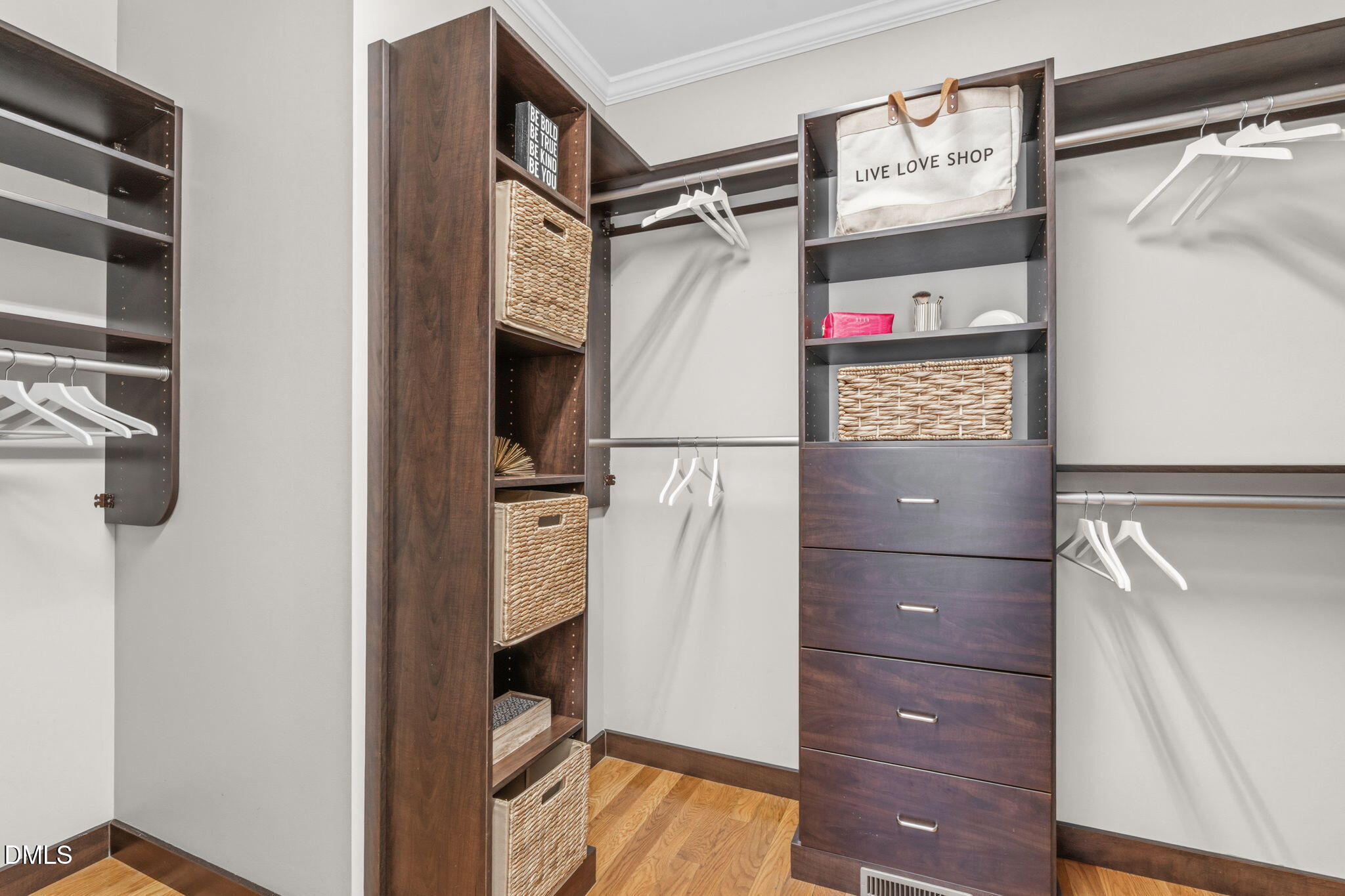 7320 Bedford Ridge Drive Apex, NC 27539 - Photo 34 of 64 a view of walk in closet with clothes and shoes