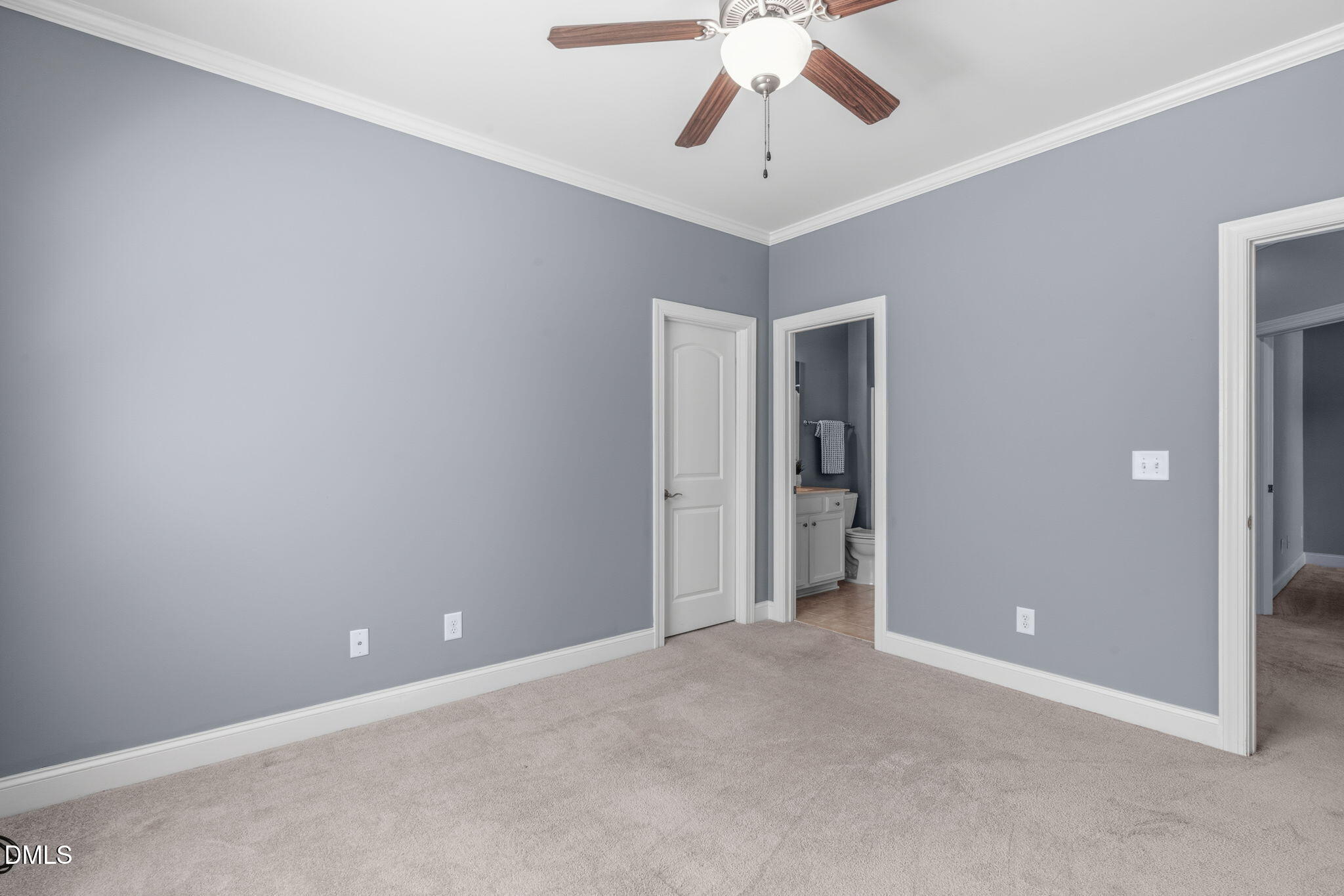 7320 Bedford Ridge Drive Apex, NC 27539 - Photo 44 of 64 a view of an empty room with a chandelier fan