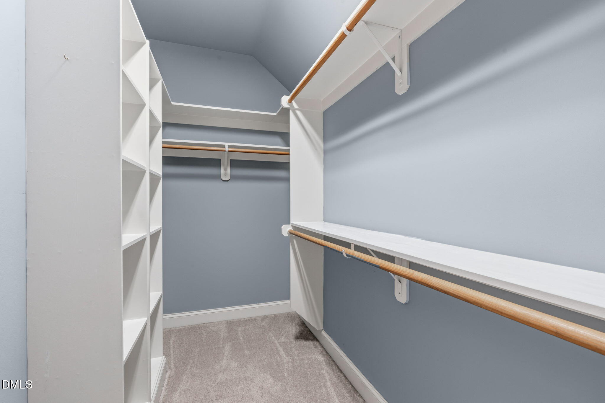 7320 Bedford Ridge Drive Apex, NC 27539 - Photo 45 of 64 a view of walk in closet with empty racks