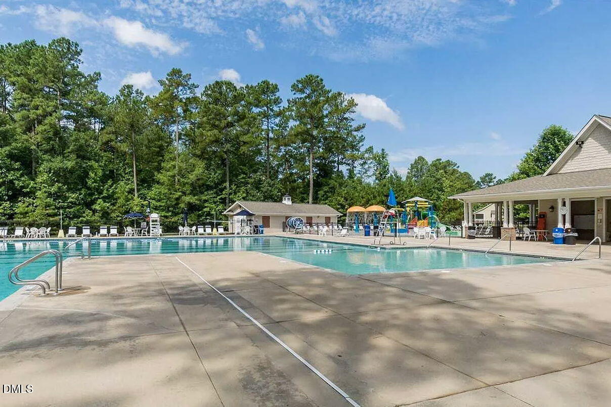7320 Bedford Ridge Drive Apex, NC 27539 - Photo 60 of 64 a view of house with outdoor space and swimming pool