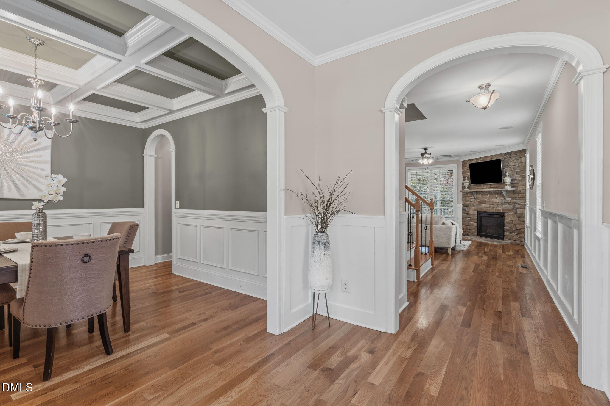 7320 Bedford Ridge Drive Apex, NC 27539 - Photo 7 of 64 a view of a hallway with wooden floor and a cabinet