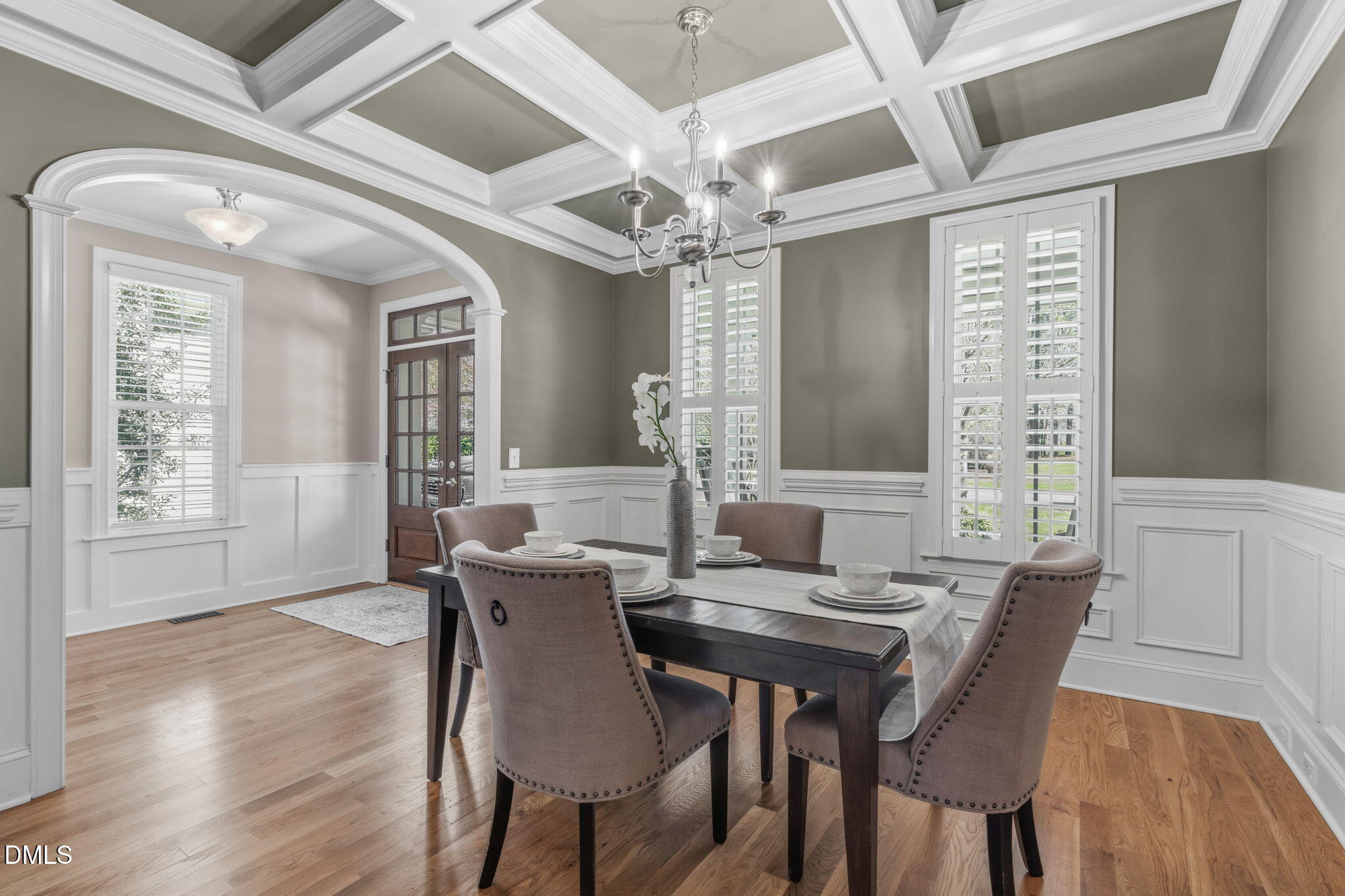 7320 Bedford Ridge Drive Apex, NC 27539 - Photo 8 of 64 a view of a dining room with furniture window and wooden floor