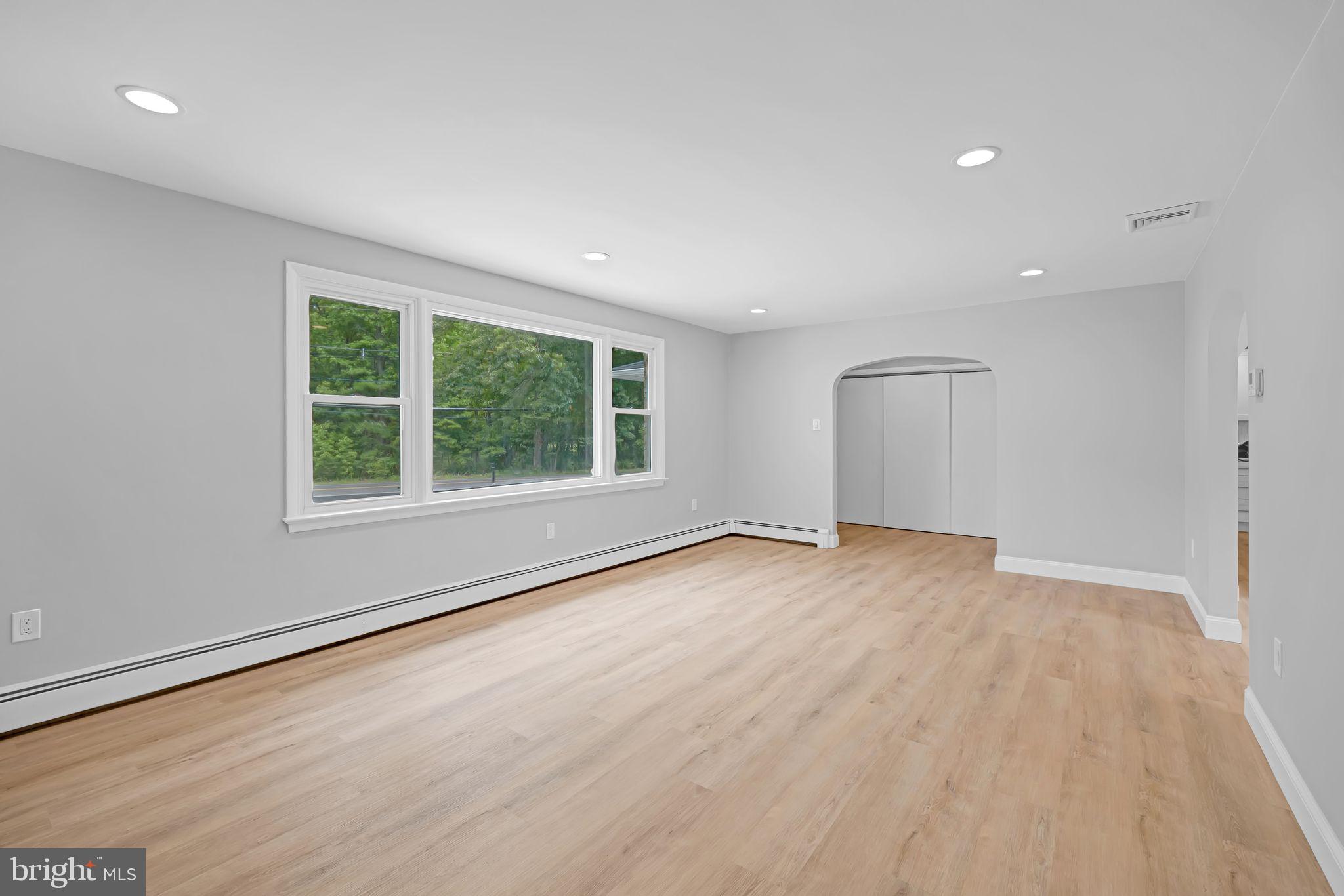 67 Christopher Mill Road Medford, NJ 08055 - Photo 9 of 32 Living room to hall foyer/coat closets
