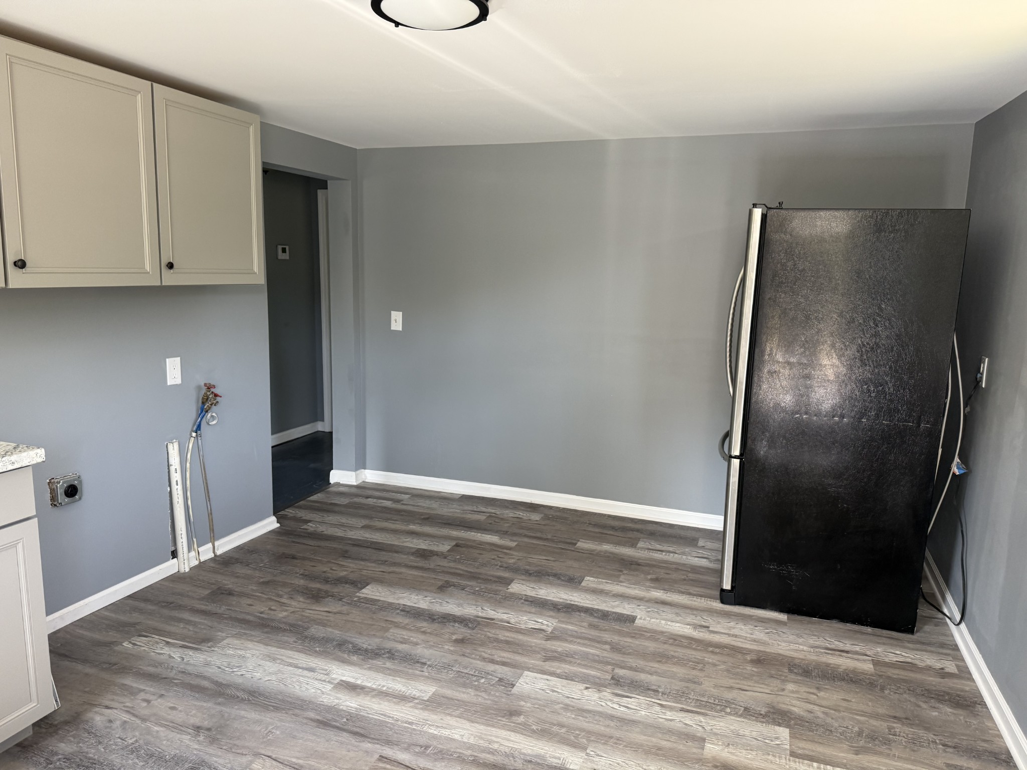 235 Richland Richardson Road Murfreesboro, TN 37130 - Photo 5 of 10 a view of an empty room with wooden floor and a mirror