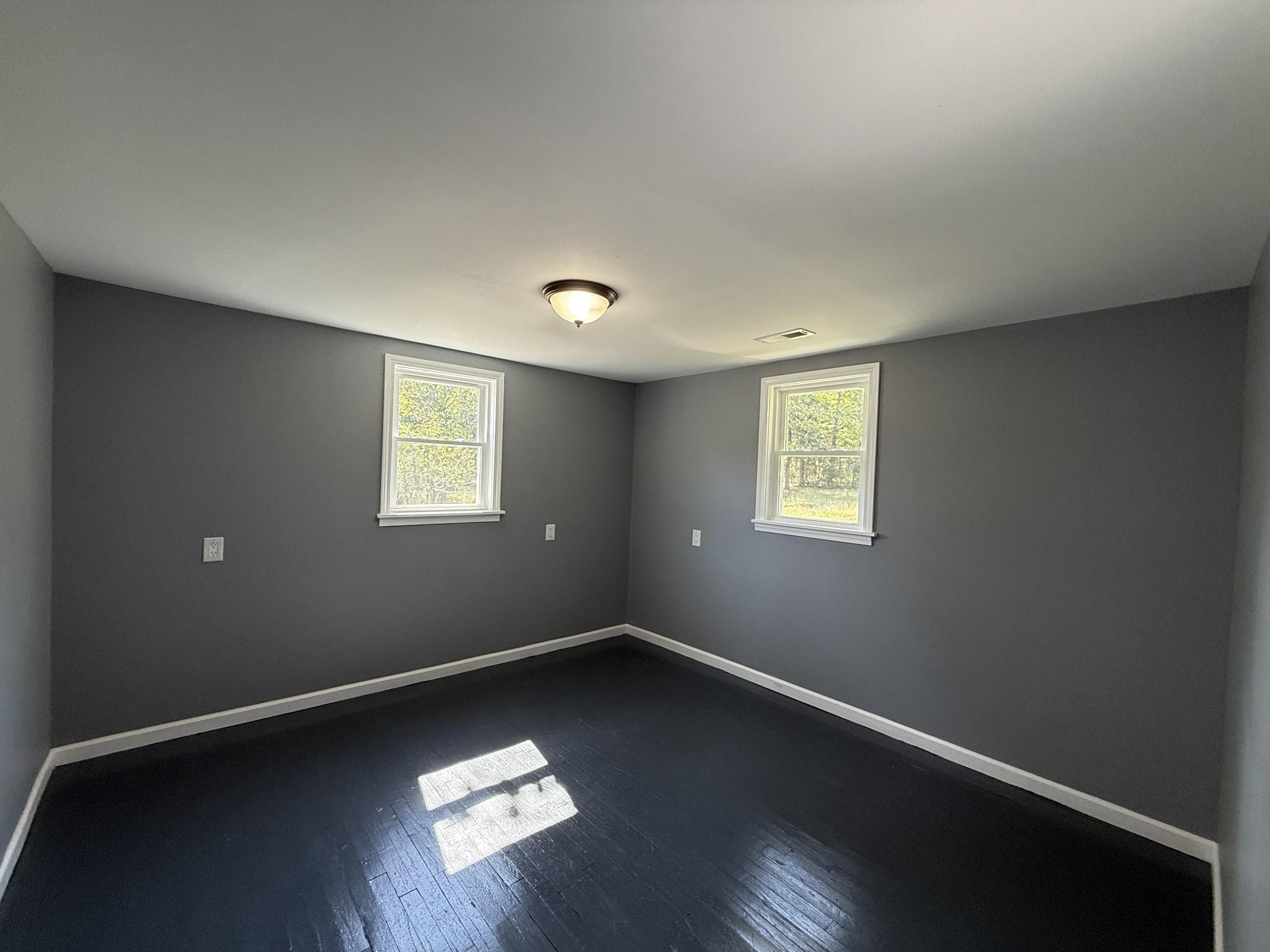 235 Richland Richardson Road Murfreesboro, TN 37130 - Photo 6 of 10 a view of an empty room with wooden floor and a window