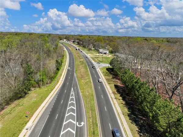 a view of a swimming pool with a yard