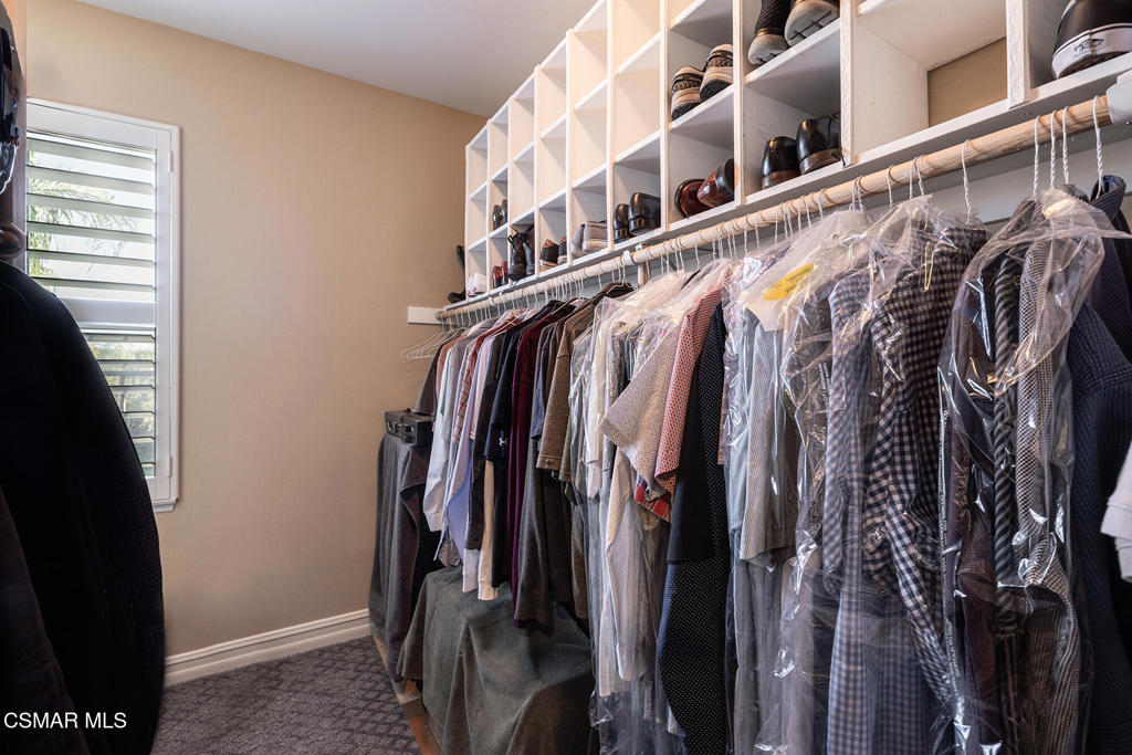 5019 Corral Street Simi Valley, CA 93063 - Photo 22 of 50 a view of walk in closet with clothes and shoes